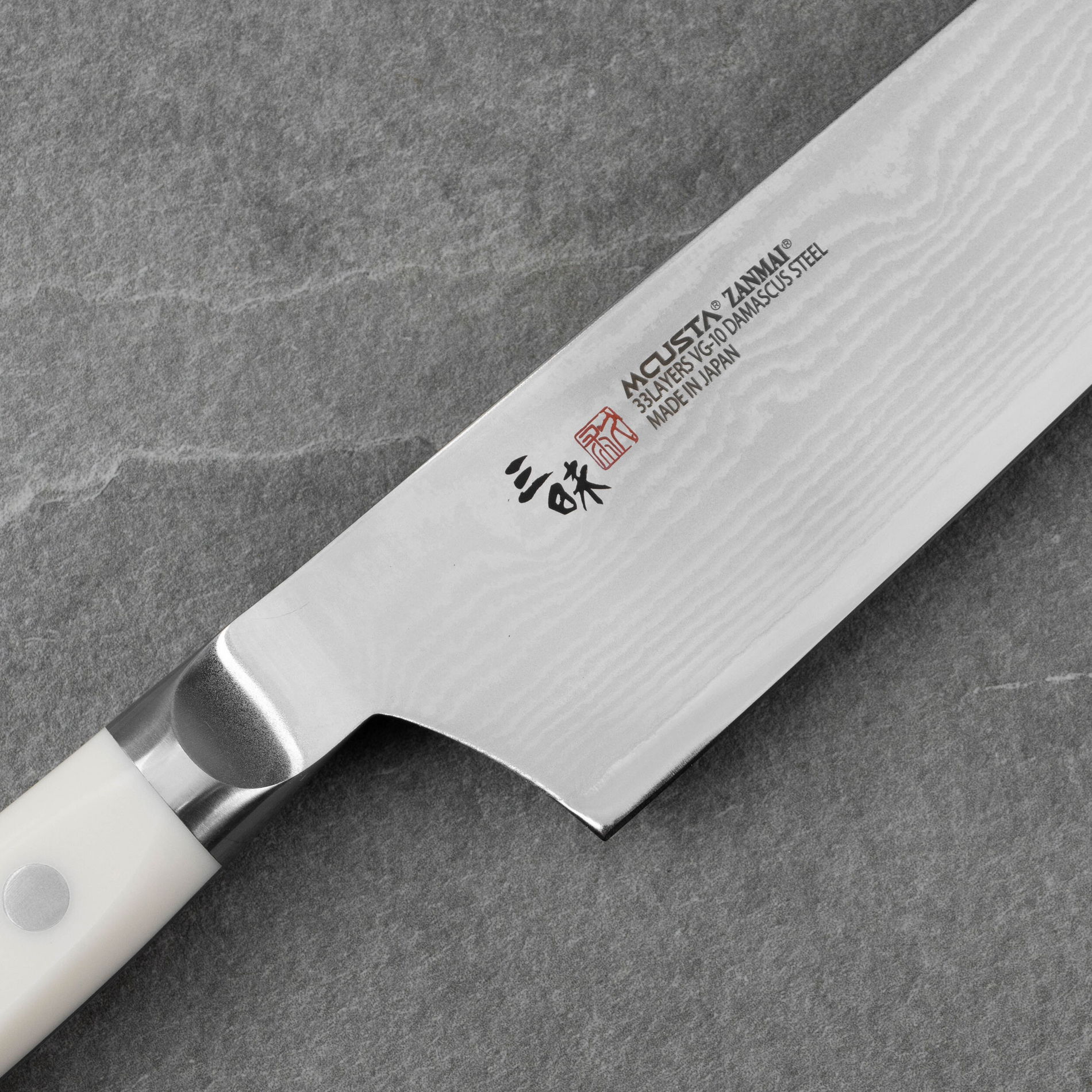 MCUSTA Zanmai Classic Damascus Corian 24 cm - japonský kuchársky nôž z damascénskej ocele